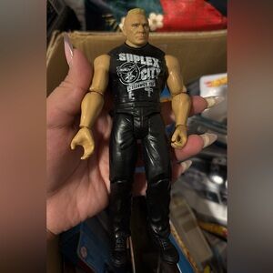 WWE Brock Lesnar action figure featuring his iconic "Suplex City" shirt